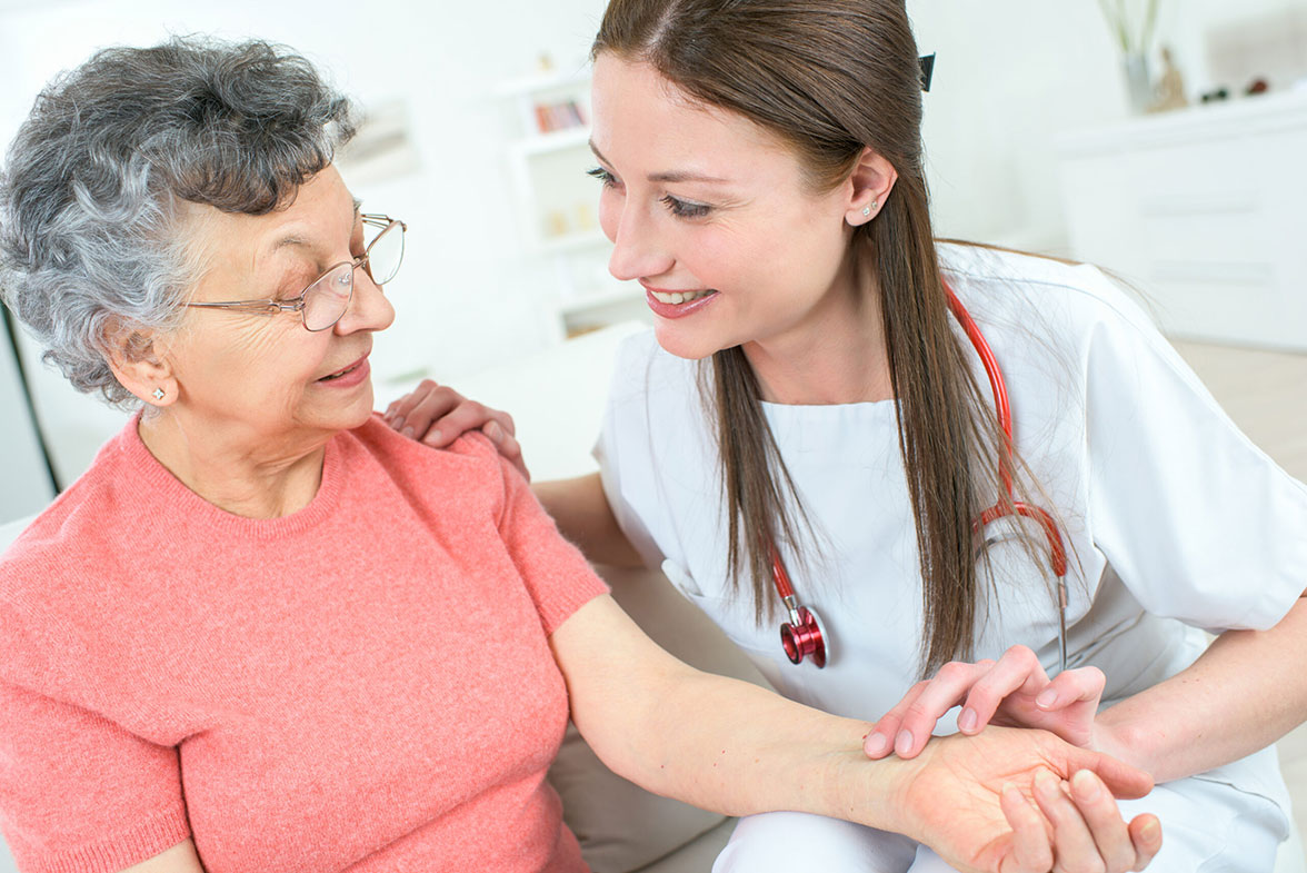 Elderly woman and her caregiver