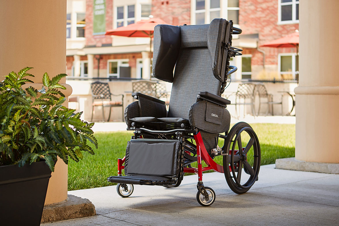 Synthesis Positioning Wheelchair in Red Outside