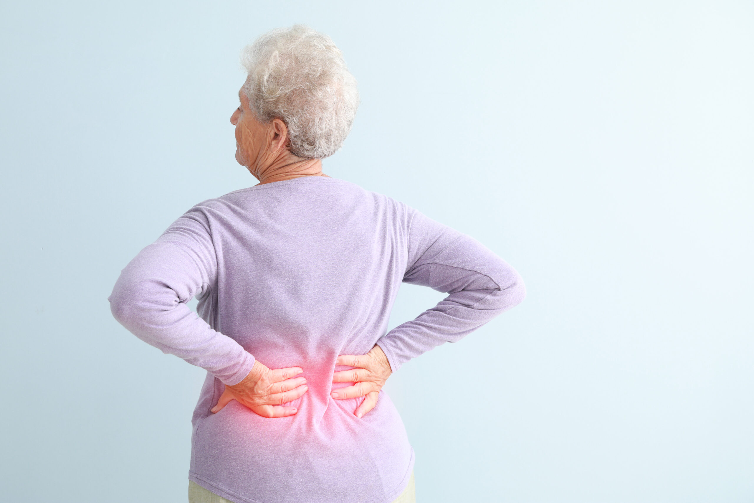 Senior woman suffering from pain in back