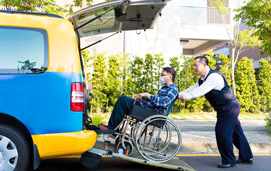 NEMT driver and passenger entering a vehicle