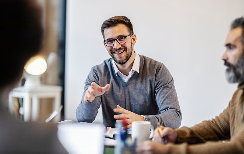 Office manager chatting hosting a small meeting