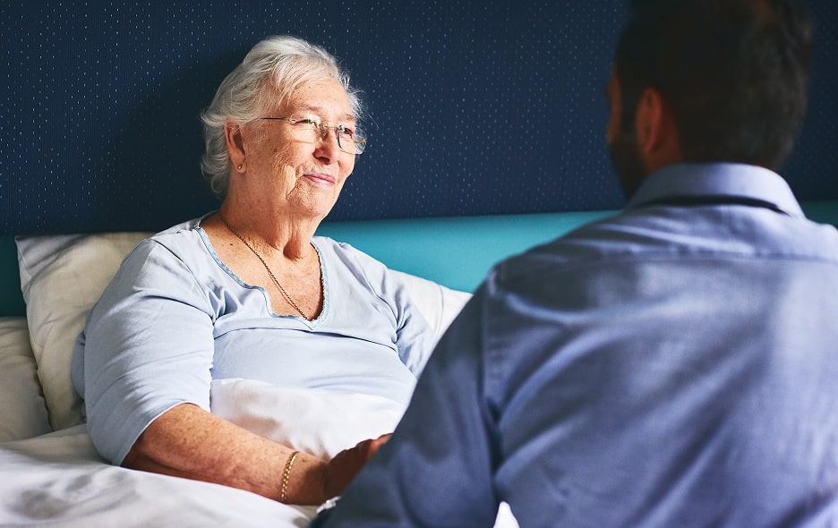 A specialist talking with potential passenger about her transport needs