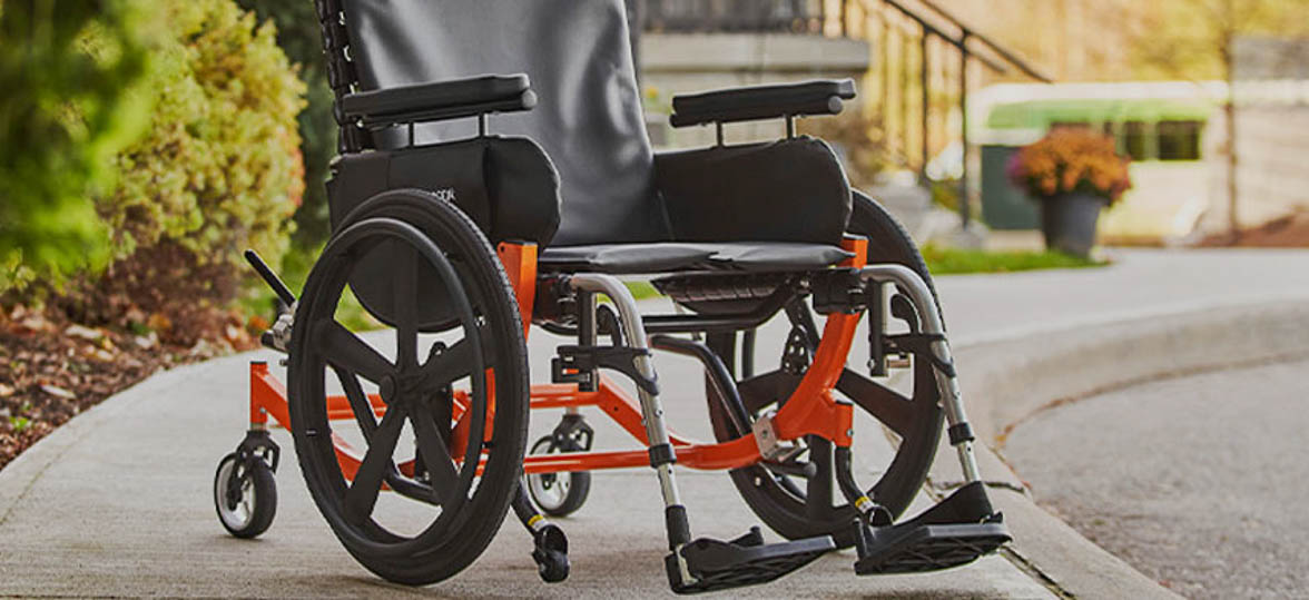 Broda wheelchair resting on a sidewalk