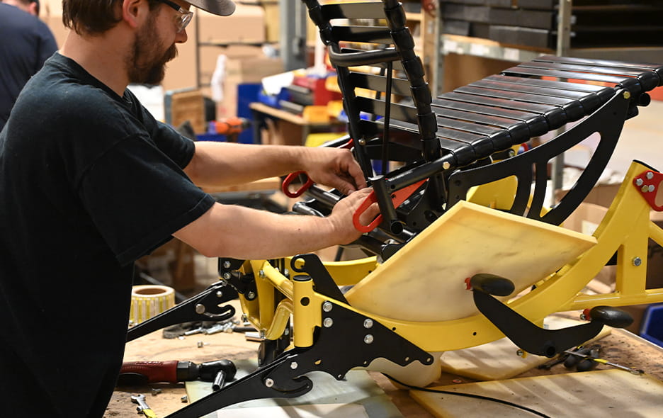 Manufacturing employee carefully crafting a Broda