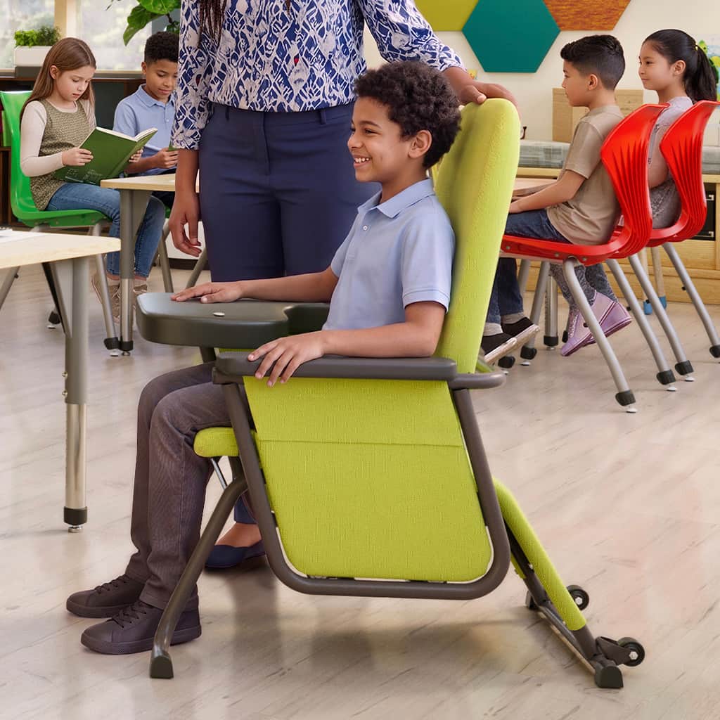 Child in an Aspire glider in a classroom setting