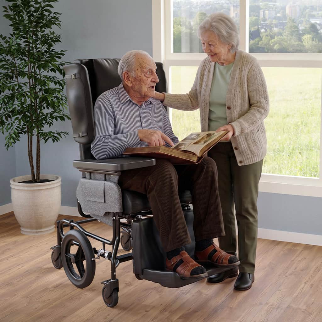 Senior man in an Elite Wheelchair as his partner stands next to him