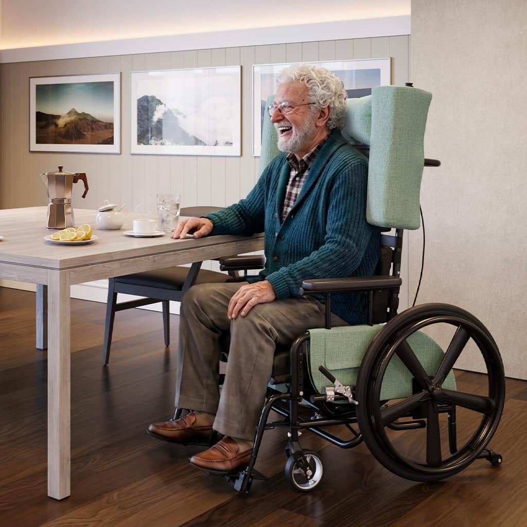 Senior man enjoying breakfast while seated in a latitude pedal wheelchair