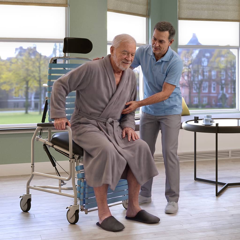 Caregiver helping a senior an into a Revive Shower Chair