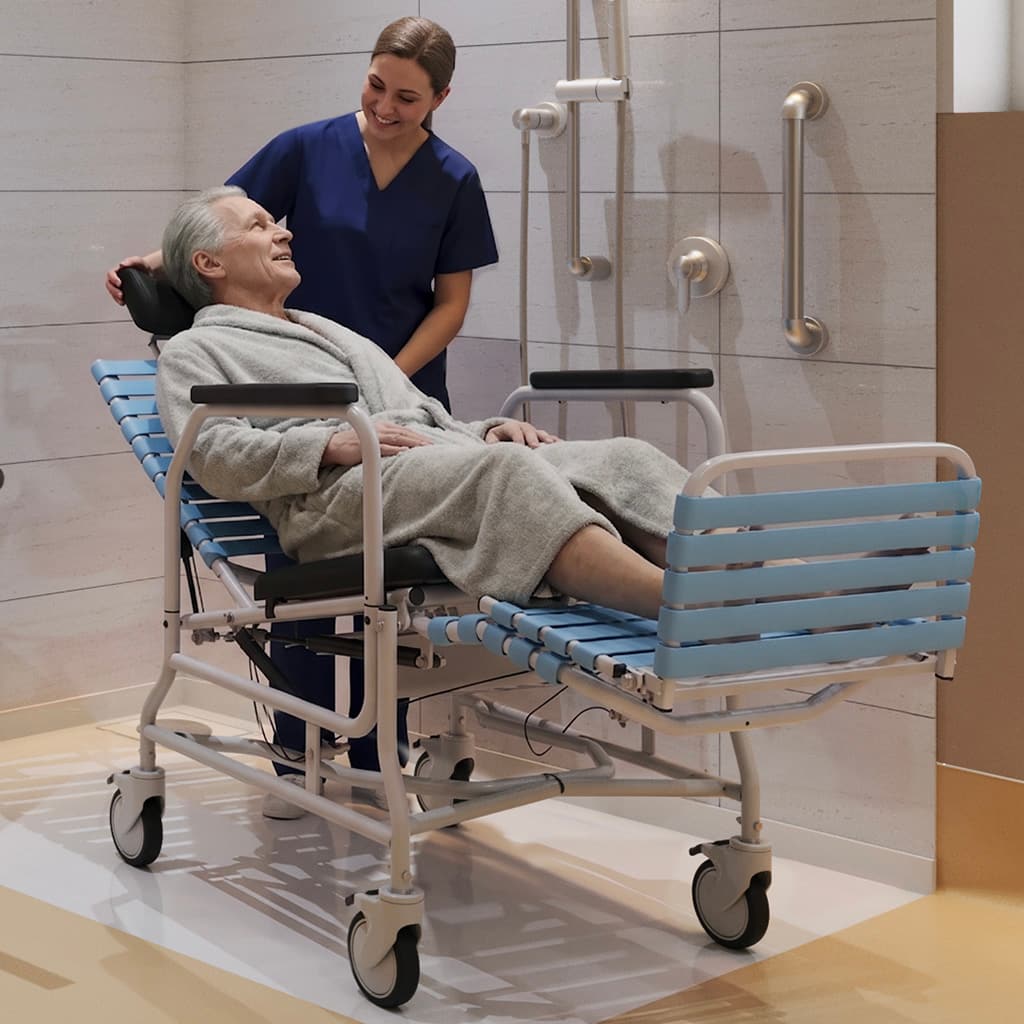 Caregiver assisting a senior man into a bathing area