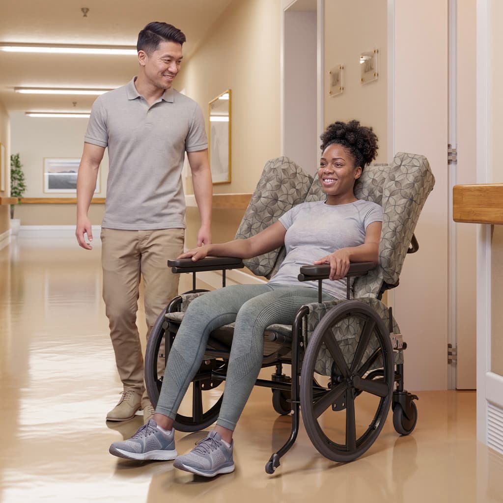 Young woman in a Sashay Pedal in the hallway of a care facility
